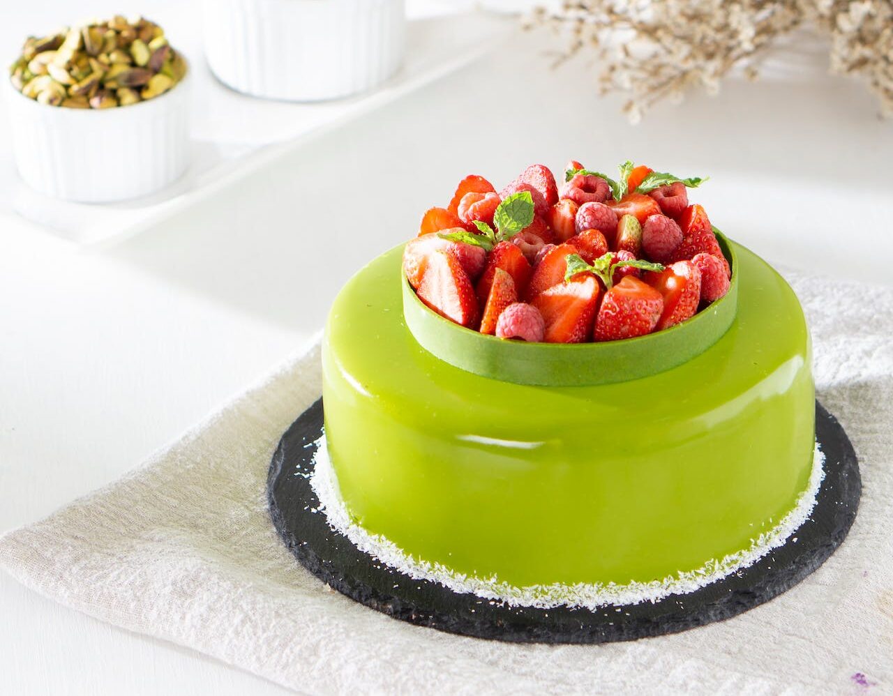lime green cake with strawberries